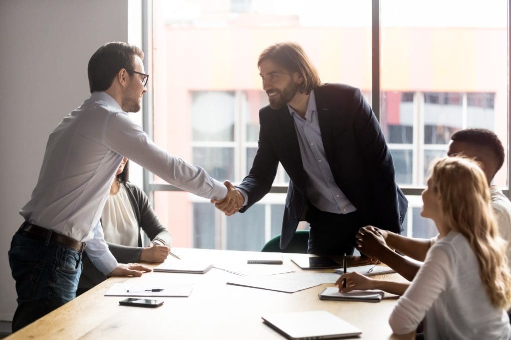Negotiation starts with leaders of business parties shaking hands