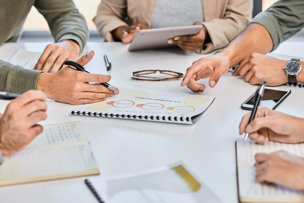 Meeting, planning or hands on documents for tax audit report or financial statement in company. Accounting, business people or closeup of strategy for finance paperwork, logistics or data analysis